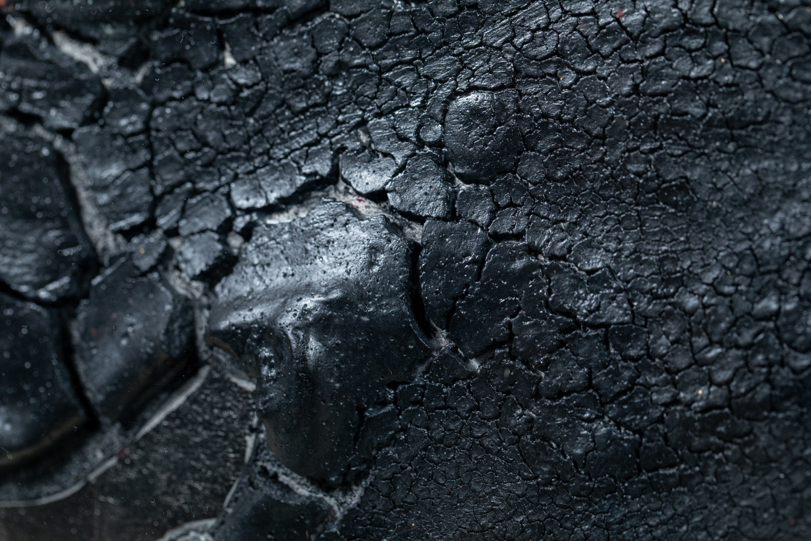 alt="Close-up detail of The Reclining Dragon Pine painting showing cracked ink texture and scattered malachite pigment by Takehiko Sugawara in Nihonga style"

