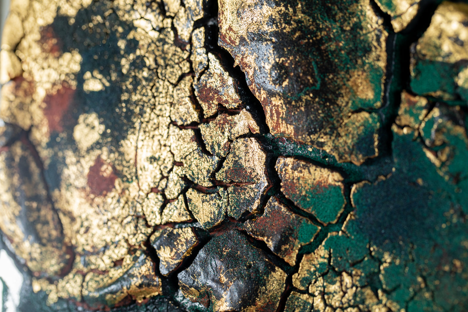 alt="Close-up detail of The Reclining Dragon Pine painting showing cracked ink texture and scattered malachite pigment by Takehiko Sugawara in Nihonga style"

